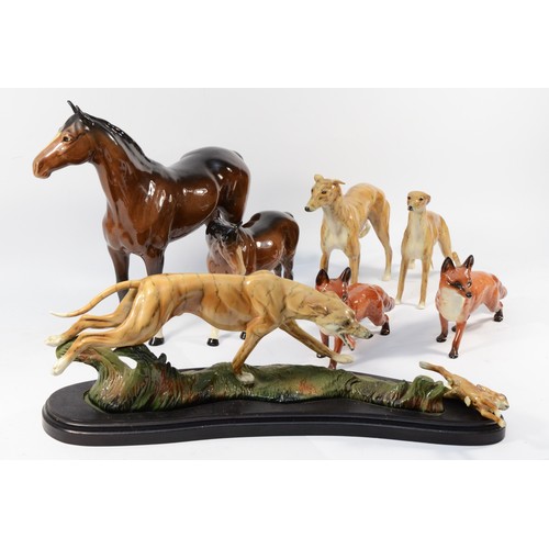 145 - Four Beswick ceramic models, to include, two standing foxes and two brunette standing horses, togeth... 