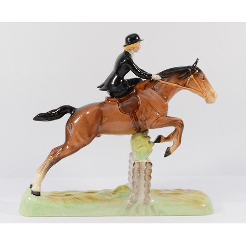 147 - A Beswick ceramic model, depicting a huntswoman on a jumping fence, model no. 982, H-25cm.