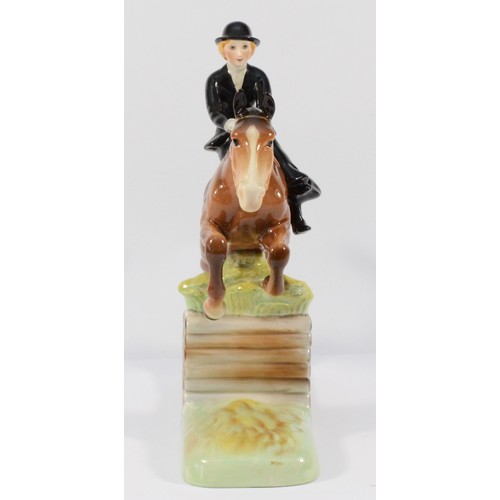 147 - A Beswick ceramic model, depicting a huntswoman on a jumping fence, model no. 982, H-25cm.