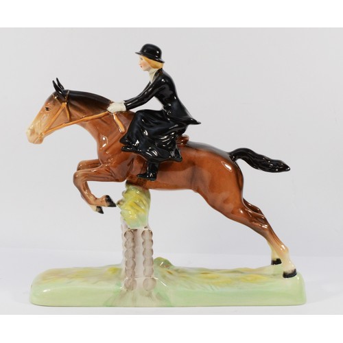 147 - A Beswick ceramic model, depicting a huntswoman on a jumping fence, model no. 982, H-25cm.