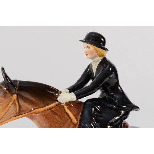 147 - A Beswick ceramic model, depicting a huntswoman on a jumping fence, model no. 982, H-25cm.