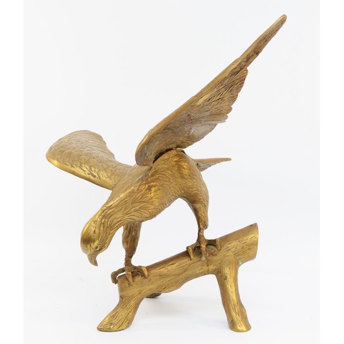 158 - A brass sculpture of an eagle on a branch, unsigned, wing span 64cm