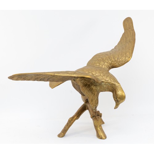 158 - A brass sculpture of an eagle on a branch, unsigned, wing span 64cm