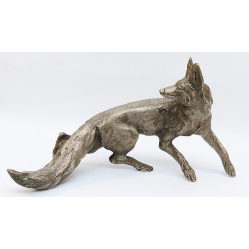 159 - A metal sculpture of a fox, unsigned, paw to tail 53cm