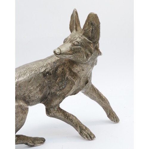 159 - A metal sculpture of a fox, unsigned, paw to tail 53cm