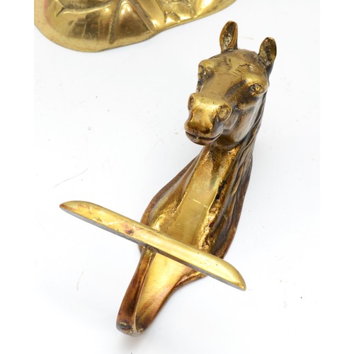 166 - A brass sculpture of a stag, 33cm, a horses head wall hook and an antelope head