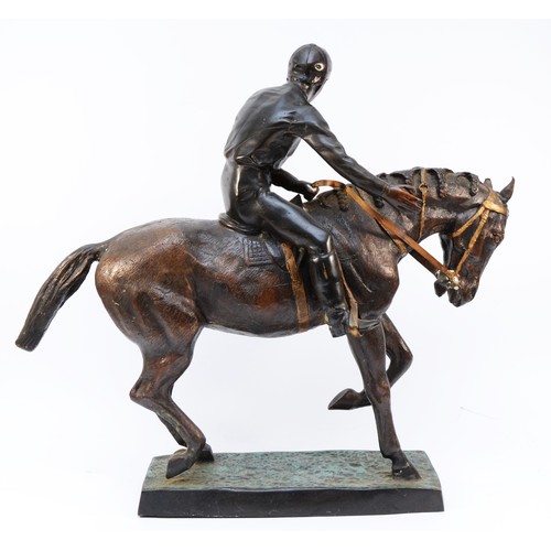 167 - After Mene, a bronze of a racehorse and jockey at a slow trot, raised on cold painted grass base, un... 