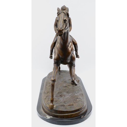 168 - After Mene, a bronze of a racehorse and jockey, on a naturalist base, raised on a marble base, unsig... 