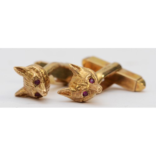 131 - Garrard & Co., a 9ct gold fox head pair of cufflinks, London 1978, ruby set eyes, together with a co... 