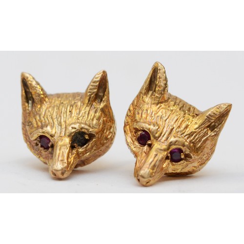 131 - Garrard & Co., a 9ct gold fox head pair of cufflinks, London 1978, ruby set eyes, together with a co... 