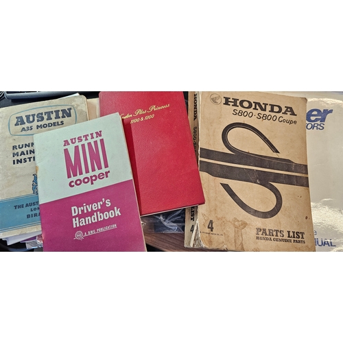 11 - A collection of motorcar owners manuals including Austin Mini Cooper 1965 and Honda S800 parts list.... 