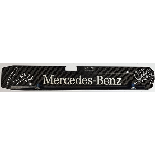 18 - Lewis Hamilton/Mikka Hakkinen, a signed Mercedes Benz carbon fibre engine plate, 44 x 7cm, together ... 