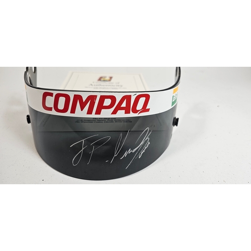 19 - Juan Pablo Montoya, a signed Compaq sponsored helmet visor, together with a CoD from the F1 Shop in ... 