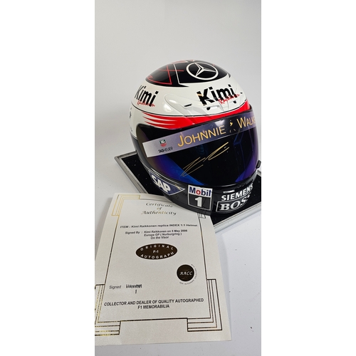 20 - Kimi Raikkonen, a signed replica Index 1:1 racing helmet, signed on the visor on the 5th May 2006, E... 