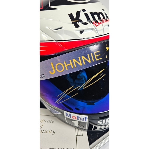 20 - Kimi Raikkonen, a signed replica Index 1:1 racing helmet, signed on the visor on the 5th May 2006, E... 