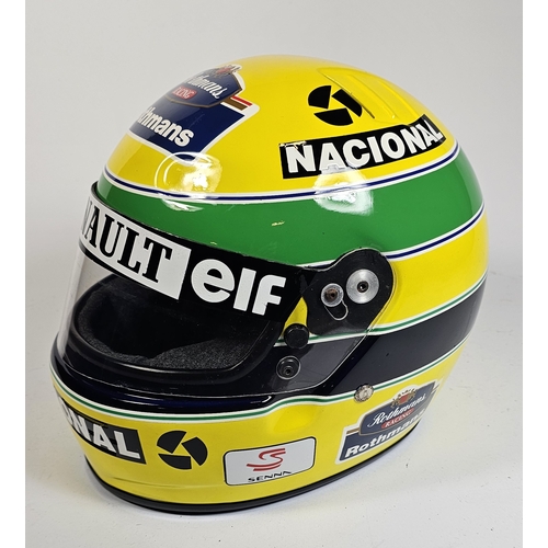 21 - Ayrton Senna, a replica racing helmet, with bag. (2 items)