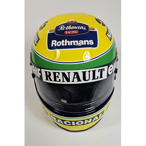 21 - Ayrton Senna, a replica racing helmet, with bag. (2 items)