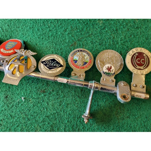 66 - Desmo badge bar with nine various badges (AA, St Christopher, Caravan Club, VCC, Riley Club, Hull, e... 