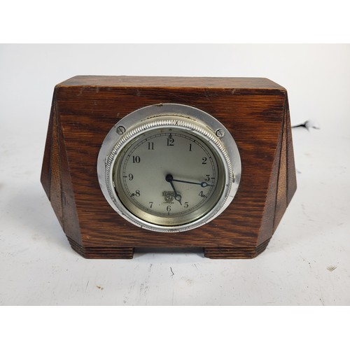 92 - A Watford Dashboard Clock, by North and Sons. Mounted in a Wooden Plaque. A Smiths, mounted in an ar... 