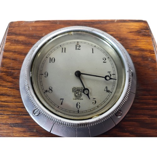 92 - A Watford Dashboard Clock, by North and Sons. Mounted in a Wooden Plaque. A Smiths, mounted in an ar... 