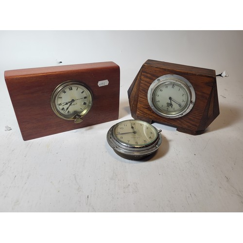 92 - A Watford Dashboard Clock, by North and Sons. Mounted in a Wooden Plaque. A Smiths, mounted in an ar... 