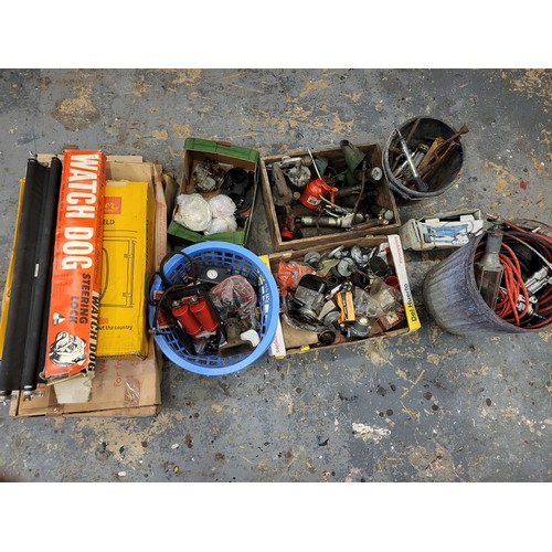 110 - Tools and car spares, a large lot to include grease guns, oil cans, a magneto, a carburettor, airlin... 