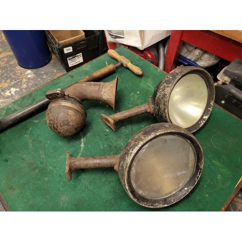 121 - Two Vintage Car Headlamps, an electric car horn, a Dunlop No.2 stirrup pump. (4 items)