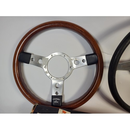 138 - A Mountney Wood Rimmed Steering Wheel, 34cm and a Triumph Stag steering wheel, along with sundry oth... 