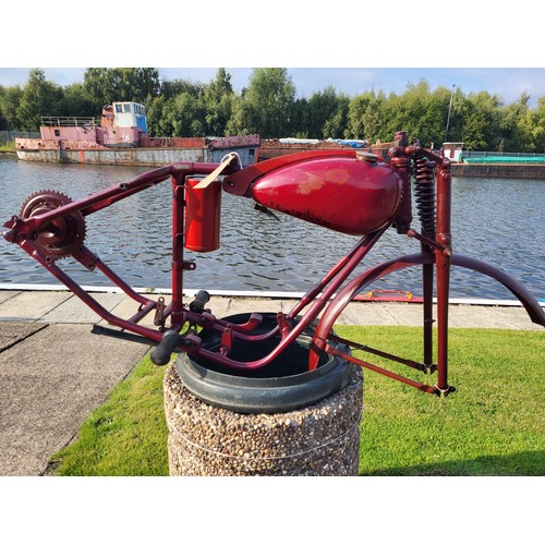 153 - A Bown motorcycle frame, and wheel, plus various sundry parts. c.1950. Designed to accept a 98cc Vil... 