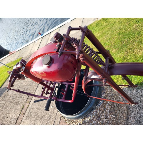 153 - A Bown motorcycle frame, and wheel, plus various sundry parts. c.1950. Designed to accept a 98cc Vil... 