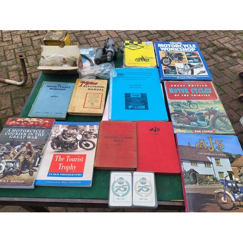 175 - BSA parts, including an Amal carburettor, a piston, some other small items, a selection of books and... 