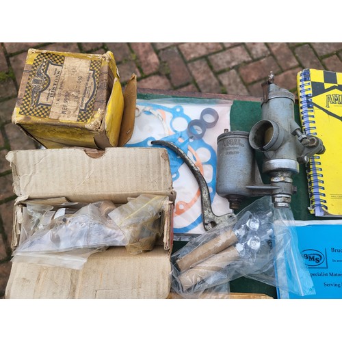 175 - BSA parts, including an Amal carburettor, a piston, some other small items, a selection of books and... 