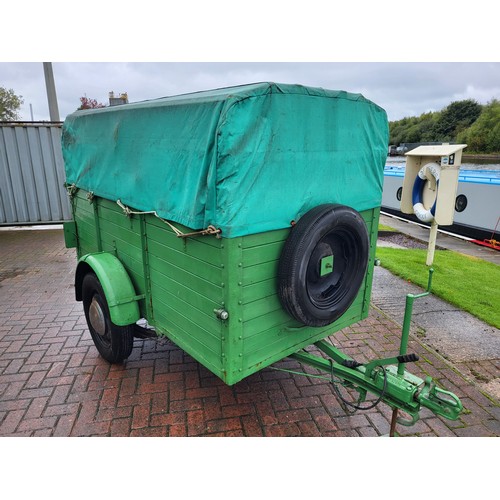 207 - A vintage car trailer, steel chassis, wooden plank construction, hinged drop down rear ramp, tarpaul... 