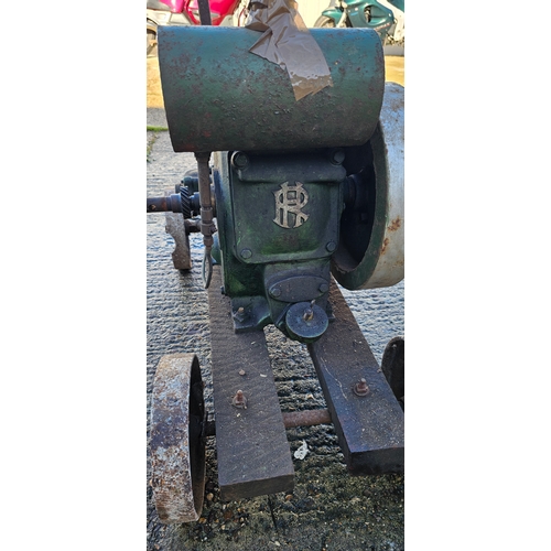 210 - A Ruston Hornsby stationary engine, 1 1/2/2hp engine. class PB trolley base. (1 item)