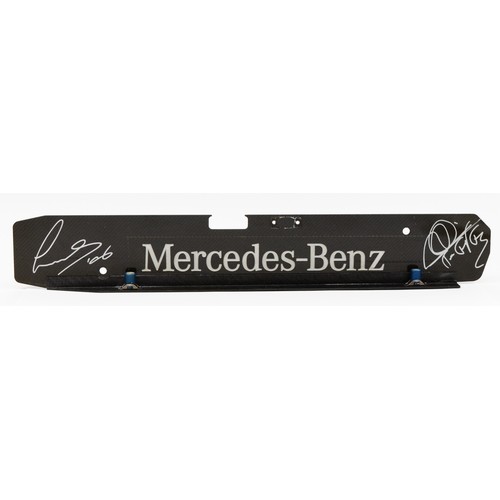 18 - Lewis Hamilton/Mikka Hakkinen, a signed Mercedes Benz carbon fibre engine plate, 44 x 7cm, together ... 