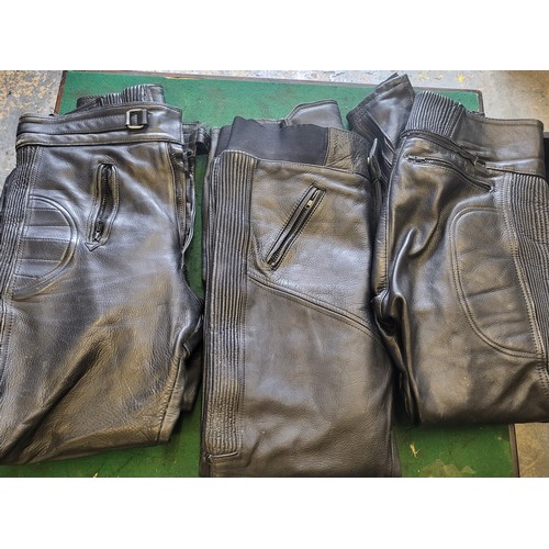 79 - Three pairs of leather motorcycle trousers;
Sportex size 32, Akito size 34, J&S size 38