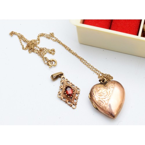 1 - An Edwardian 9ct rose gold front and back locket, a 9ct gold lozenge pendant and a quantity of costu... 