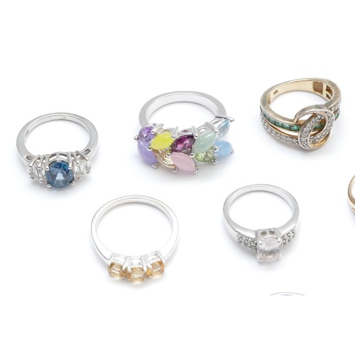 22 - Eight silver and gemset rings, to include emerald and tanzanite, L - R, 54gm