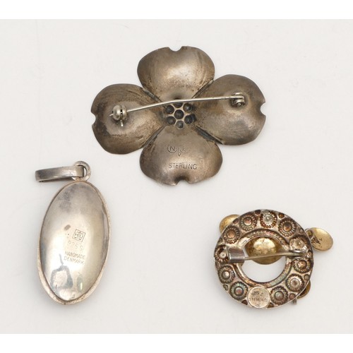 30 - Two Scandinavian silver brooches and an amber set pendant, 11gm