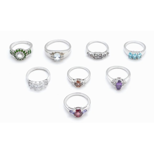 35 - Eight silver and gemset rings, including topaz, L - V, 27gm