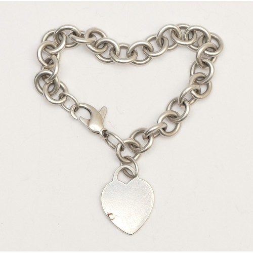 36 - Tiffany & Co., a silver bracelet with heart charm, 34gm