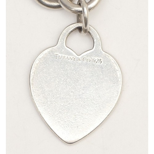 36 - Tiffany & Co., a silver bracelet with heart charm, 34gm