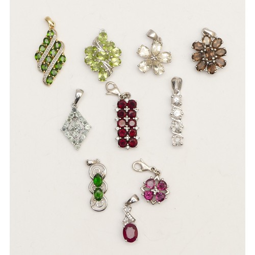 39 - Ten silver and gemstone set pendants, including diopside and garnet, 26gm