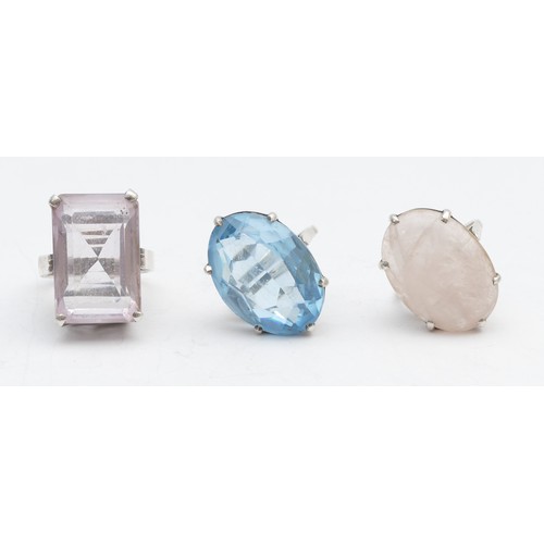 43 - A silver and pink quartz dress ring, 25 x 17mm, R and two other silver dress rings, 31gm