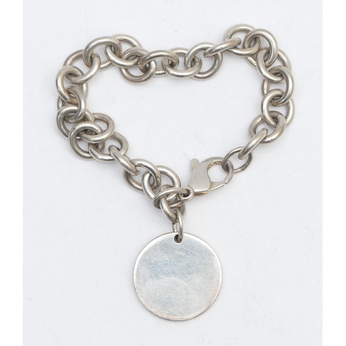 53 - Tiffany & Co., and silver bracelet with disc, 37gm