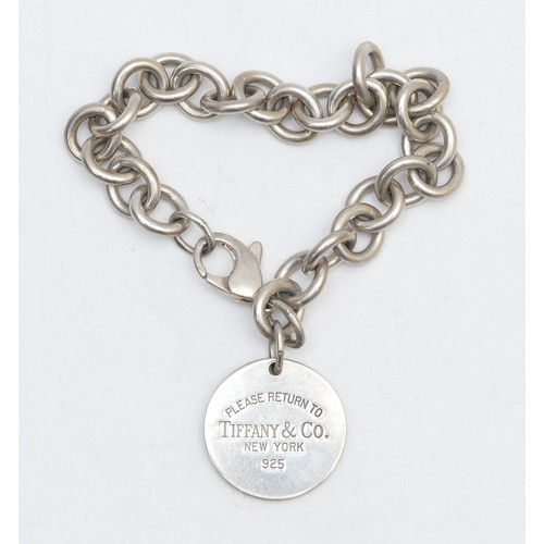 53 - Tiffany & Co., and silver bracelet with disc, 37gm