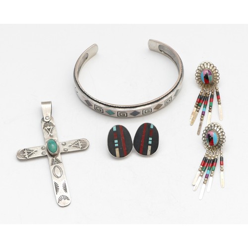 54 - A Native American silver and stone set bangle, a cross pendant and two pairs of ear rings, 49gm