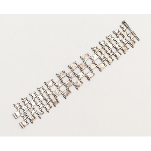 57 - A Modernist 925 silver/750 gold open panel link bracelet, 18cm, 48gm