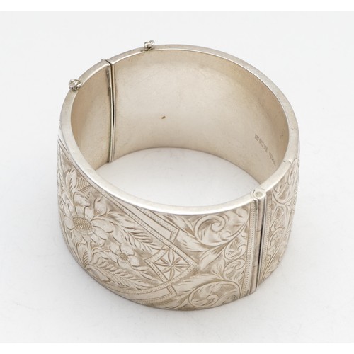 63 - A silver hinged bangle, Birmingham 1962, 60 x 58mm, width 38mm, 67gm