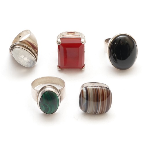 64 - Five silver and stone set rings, including carnelian, O, banded agate and moonstone, 53gm